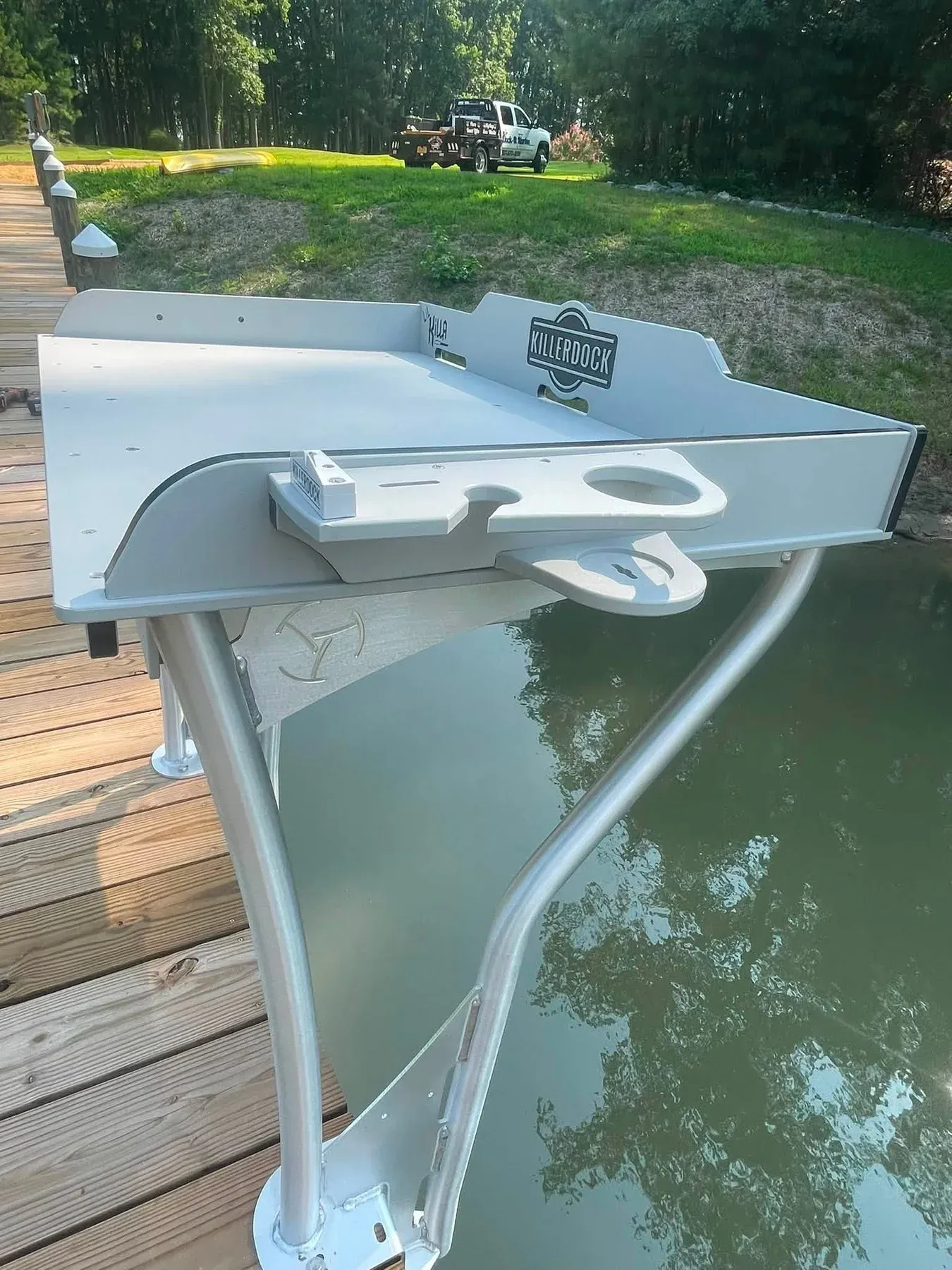 A fish-cleaning station mounted on the rail of a new pier